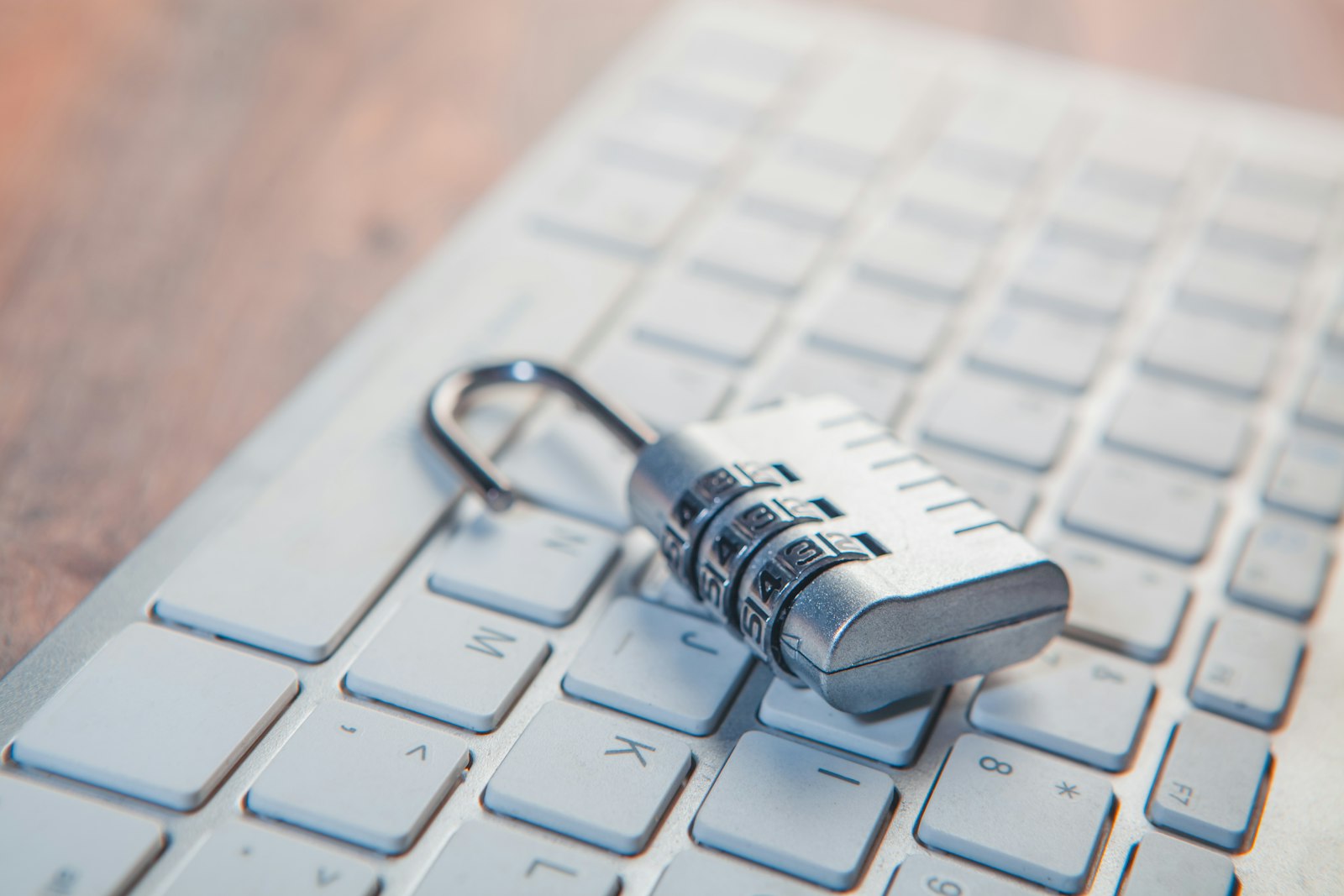 Combination lock resting on a computer keyboard