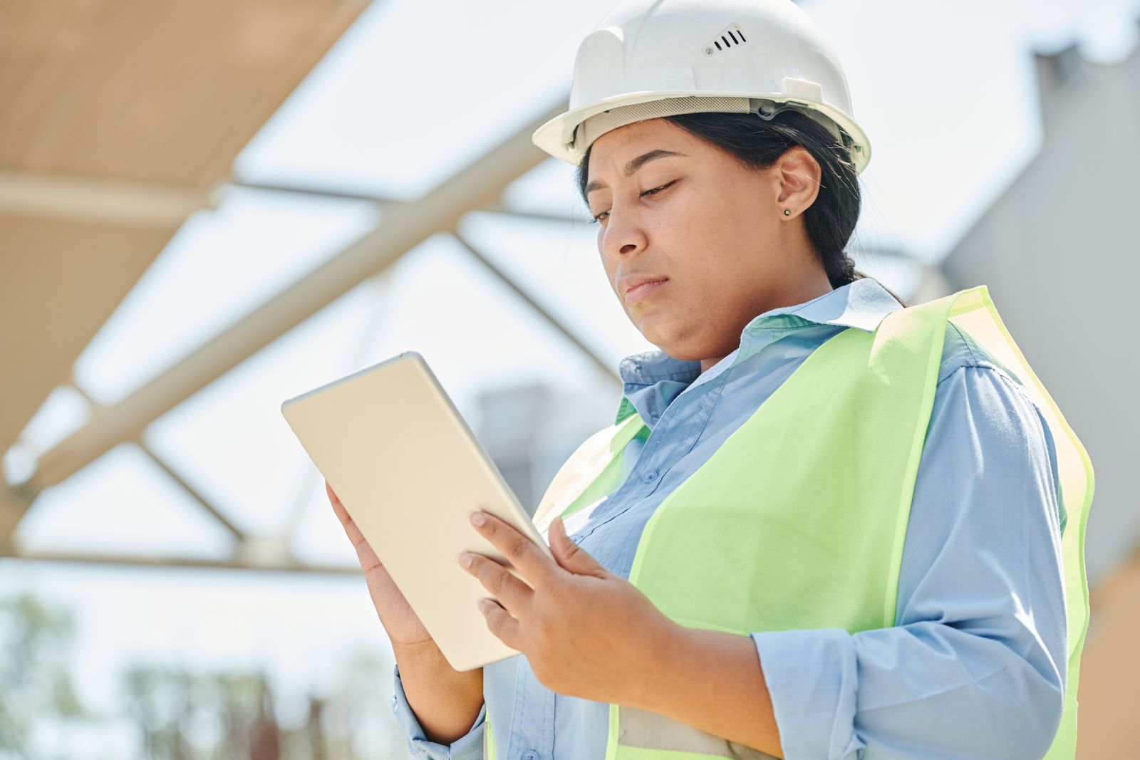 Construction engineer using a digital tablet on site