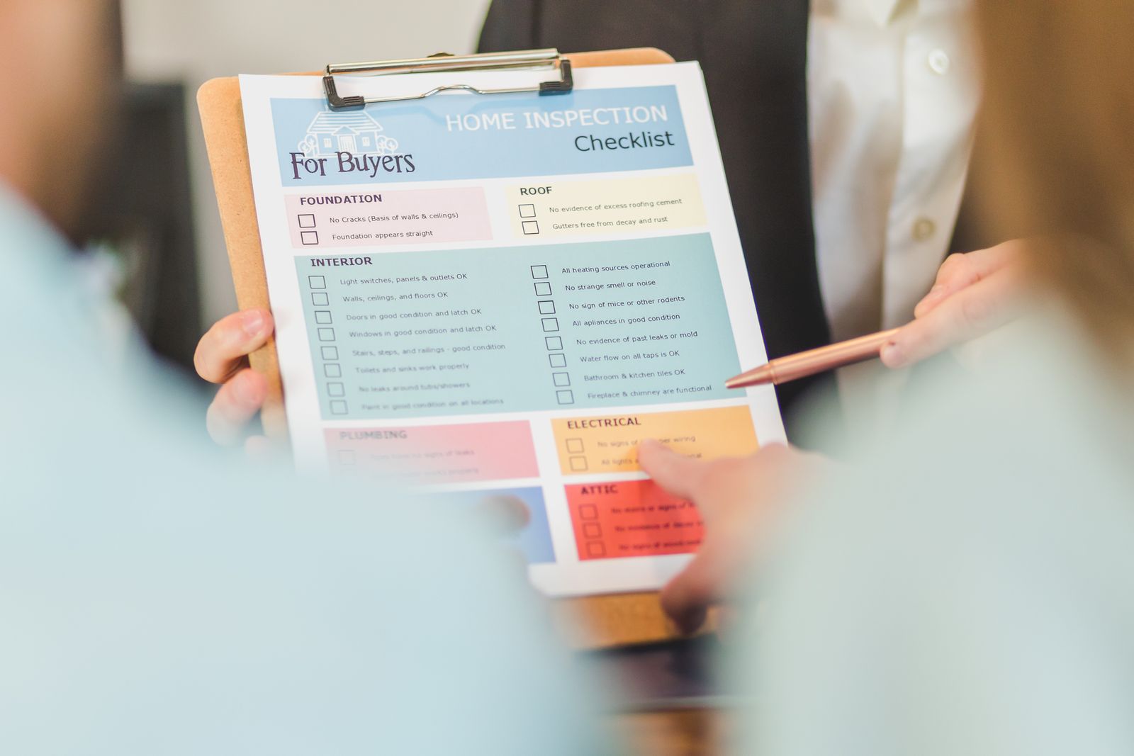 Close-up of a checklist on a clipboard with a pen